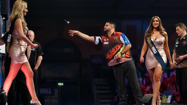 Walk-on girls have been banned from darts tournaments. Picture: John Walton