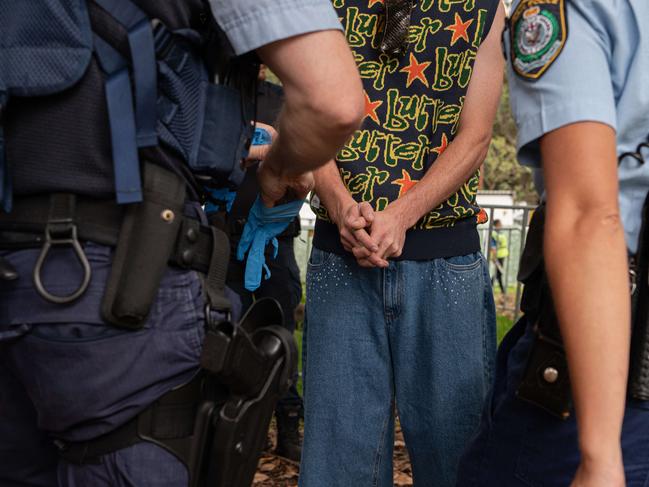 SYDNEY, AUSTRALIA - NewsWire Photos , JANUARY 01, 2024: A man is being detained by police are at the Field Day Music festival in Sydney. Picture: NCA NewsWire / Flavio Brancaleone