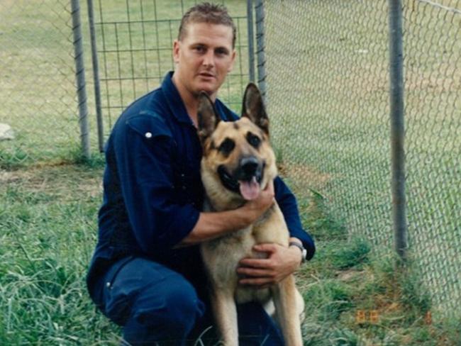 Riot Squad officer David Golledge with his drug detection and attack dog Ben. Picture: Supplied