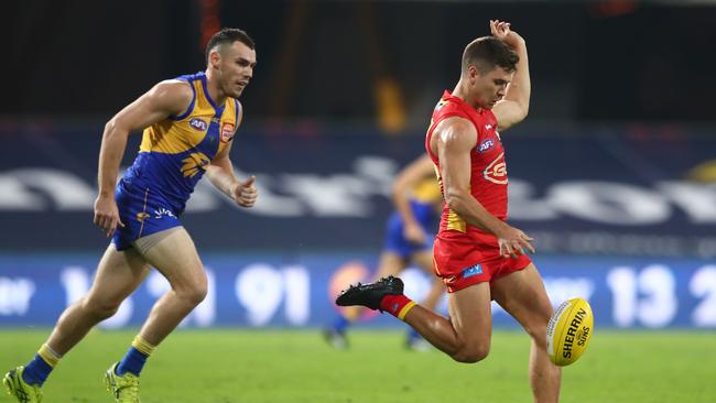 Connor Budarick of the Suns kicks during the round 2 AFL match between the Gold Coast Suns and the West Coast Eagles at Metricon Stadium on June 13, 2020 in Gold Coast, Australia. (Photo by Chris Hyde/Getty Images)