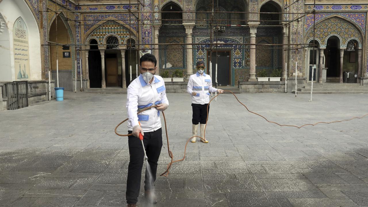 Workers disinfect the shrine of the Shiite Saint Imam Abdulazim to help prevent the spread of the new coronavirus in Shahr-e-Ray, south of Tehran. Picture: AP/Ebrahim Noroozi