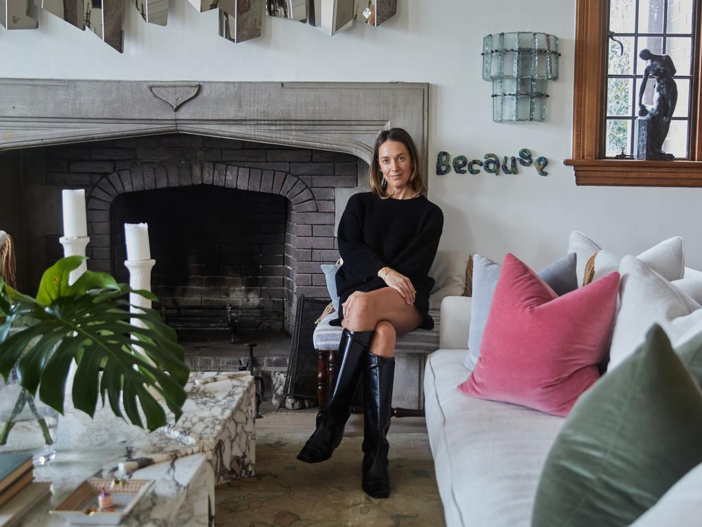 EMBARGO FOR MANSION 31 MAY 2024. FEE MAY APPLY. Tamsin Johnson in her home with vintage sculpture behind her. Photo: Supplied