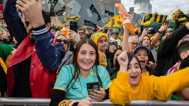 Fans of the Matildas go wild for their heroes in Federation Square, Melbourne, ahead of the FIFA Women’s World Cup. Picture: Jason Edwards