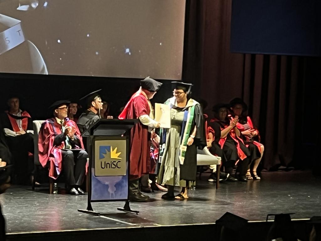 Graduates from the University of the Sunshine Coast's Fraser Coast campus celebrating at the Brolga Theatre.