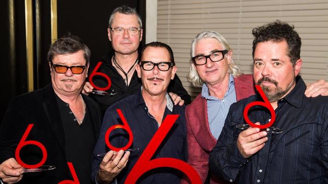 Tim Farriss, Jon Farriss, Kirk Pengilly, Chris Murphy and Andrew Farriss with INXS' award for its The Very Best album achieving six times platinum sales in 2016. Picture: Supplied