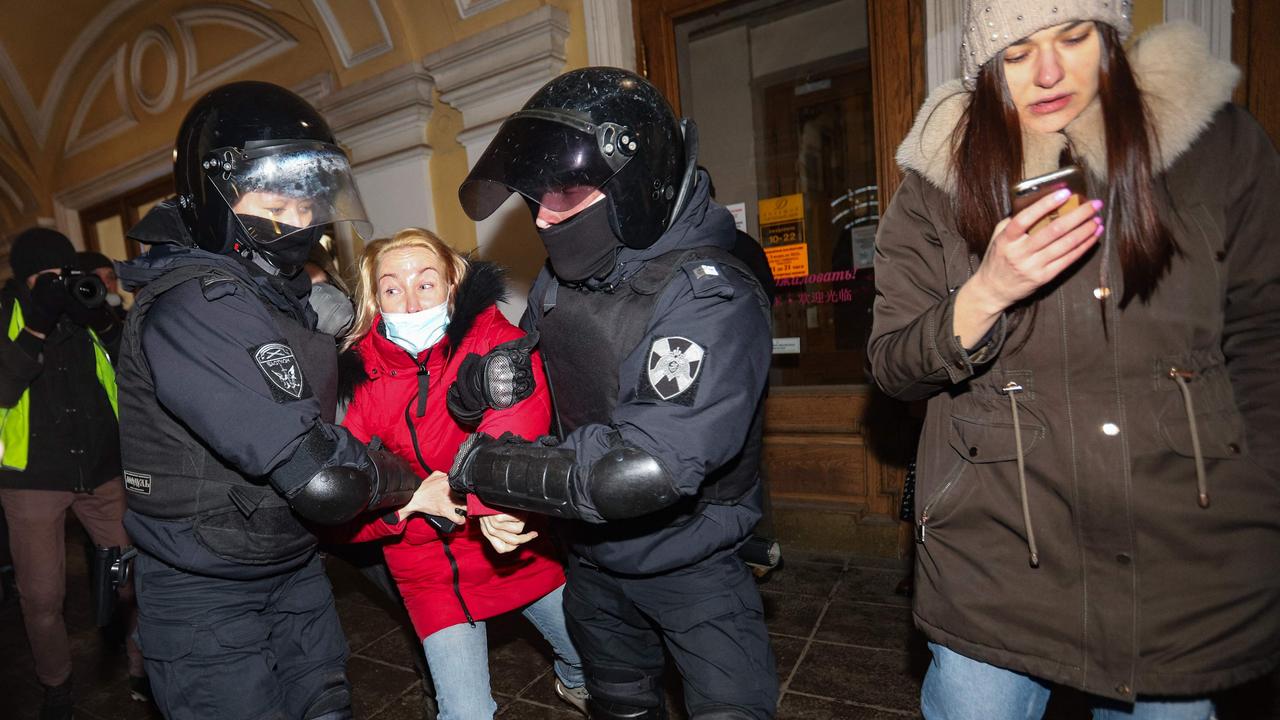 Police officers detain a demonstrator during a protest against Russia's invasion of Ukraine in central Saint Petersburg. Picture: Sergei Mikhailichenko/AFP