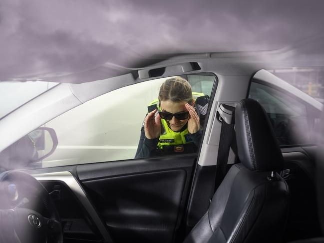 Acting Sergeant Cath Llewelyn checking cars at Fountain Gate shopping centre. Picture: Penny Stephens