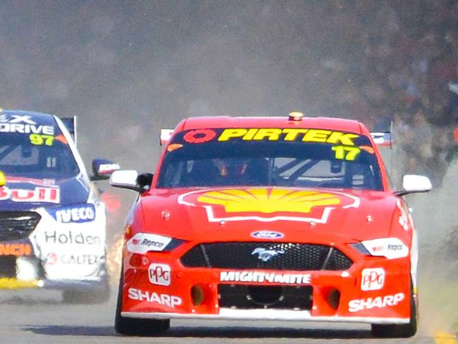 Superloop Adelaide 500 race, Saturday, March 2, 2019. The start of Race 1 for the Supercars. Shane van Gisbergen, Fabian Coulthard and Scott McLaughlin sprint to the first corner. (AAP Image/Brenton Edwards)