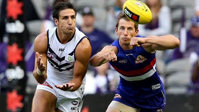 Matthew Pavlich marks in front of Dale Morris. Picture: Wayne Ludbey