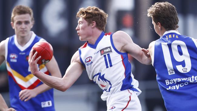 Rowell gets a handball away for one of his 44 possessions in the grand final. Picture: Daniel Pockett/AFL Photos/via Getty Images.