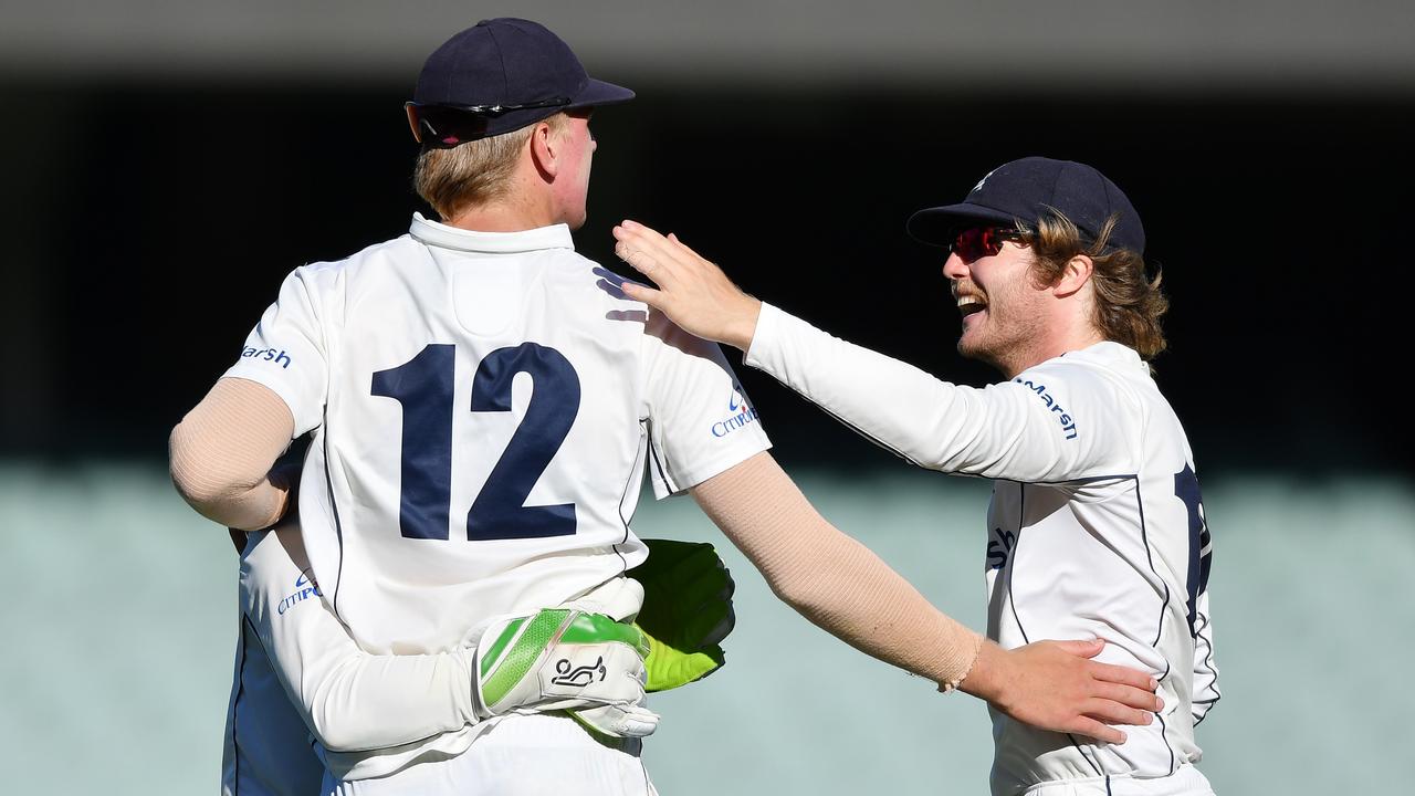 Will Sutherland celebrates a wicket with teammate Will Pucovski. Photo by Mark Brake/Getty Images