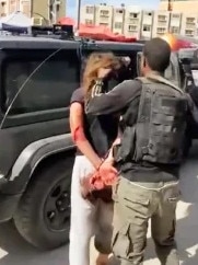 19-year-old Israeli Naama Levy being shoved into a car by Palestinian militants.