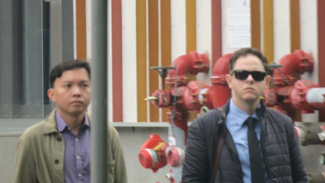 Gavin Barrett (right), 30, of Toukley, arriving at Wyong Local Court with a supporter (left) where Barrett pleaded guilty to filming a person in a private at. Picture: NewsLocal