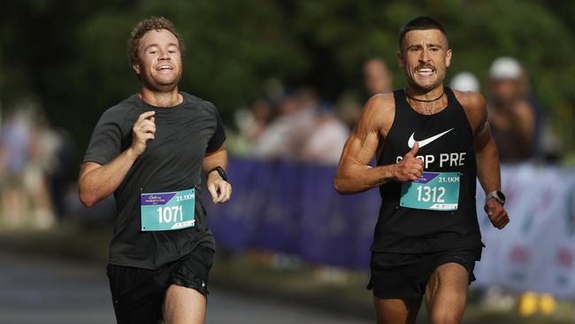 Samuel Padgett and Henry Jones finish the half marathon. 2025 Cadbury Marathon. Picture: Nikki Davis-Jones