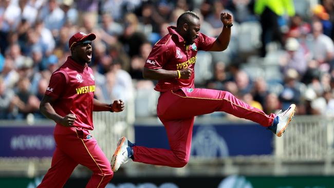 Andre Russell of the West Indies celebrates after taking the wicket of Usman Khawaja. Picture: Getty Images