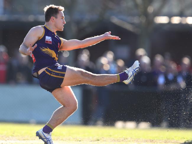 Tom Maas gets a kick away for Vermont. Picture: David Crosling