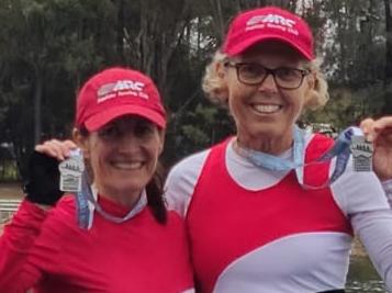 Therese Clancy (left) winning one of her many rowing medals. Picture: Supplied.