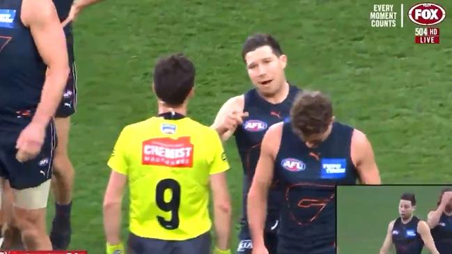 The bump in question. Toby Greene walks towards umpire Matt Stevic. Picture: FoxSports