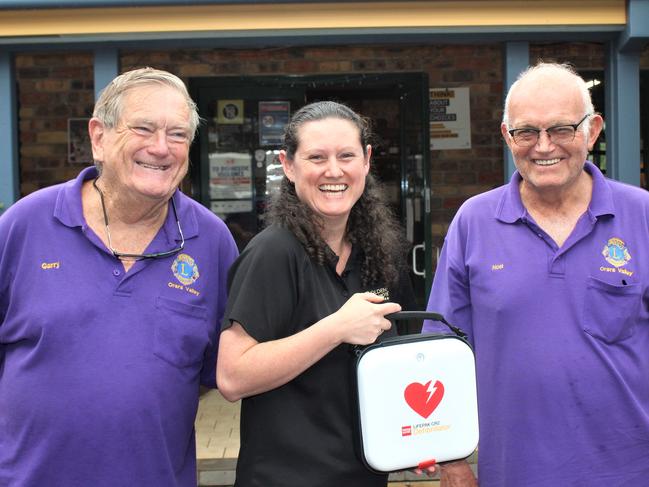 Orara Valley Lions Club president Gary Elston, Golden Dog Hotel owner Stephanie Luck and club secretary Noel Backman with the new defibrillator. Photo: Tim Jarrett