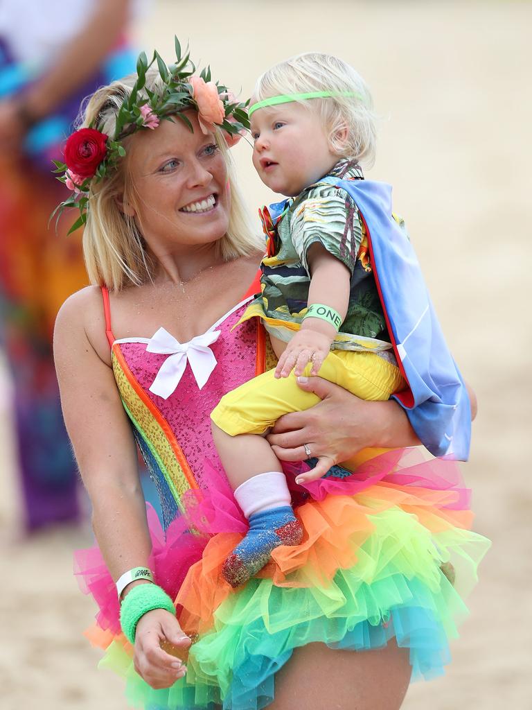 A woman and child dressed up to take part in 'Fluoro Friday', which is part of OneWave, an awareness group for mental health and wellbeing.