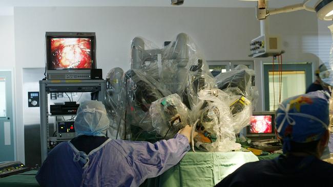 Surgeons using da Vinci Surgical System robotic surgical equipment on a patient at Epworth in 2003.