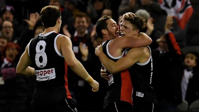 Jack Billings is mobbed by teammates Jack Steven and Jack Newnes after his matchsealer. Picture: AAP