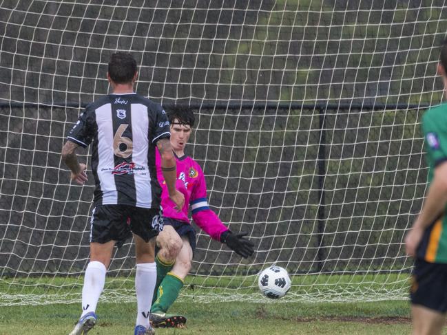 Trent Ingleton of Willowburn gets a goal past Highfields captain keeper David Mitchell in Toowoomba Football League Premier Men round one at Highfields Sport Park, Sunday, March 7, 2021. Picture: Kevin Farmer