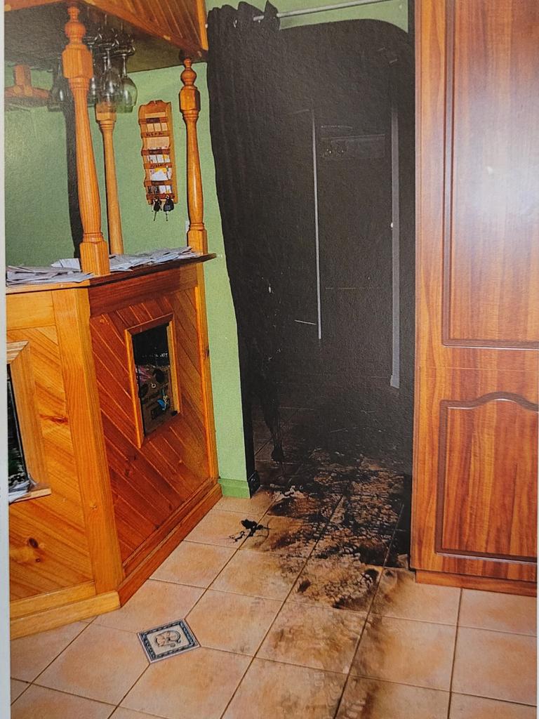 Crime scene images from inside the Alzuain home tendered during the trial show damage, caused by a molotov cocktail thrown into the home on November 20, 2012. Image released by the Supreme Court.