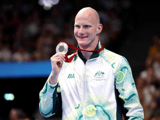 NANTERRE, FRANCE - SEPTEMBER 01: Silver medallist Rowan Crothers of Team Australia celebrates on the podium at the Para Swimming Men's 100m Freestyle - S10 Medal Ceremony on day four of the Paris 2024 Summer Paralympic Games at Paris La Defense Arena on September 01, 2024 in Nanterre, France. (Photo by Sean M. Haffey/Getty Images)