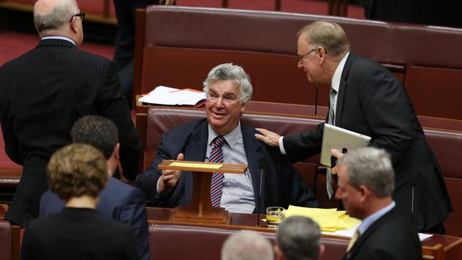 Job ID. PD302531. Senator Ron Boswell delivering his valedictory speech in the Senate Chamber, received a standing ovation at Parliament House in Canberra. Ron is congratulated by outspoken Senator Ian Macdonald. Pic by Gary Ramage