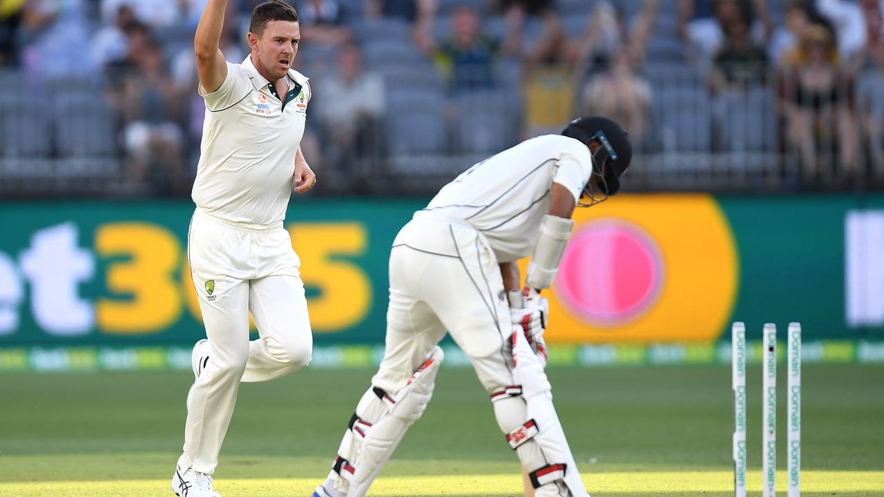 Josh Halzewoods rips through Jeet Raval during New Zealand’s first innings in Perth.