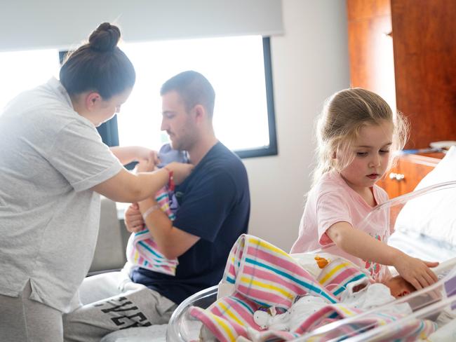 Caitlyn and Josh Stephens, pictured with daughter Harlow, 5, and newborn twins Tommy and Luca. Picture: Mark Stewart