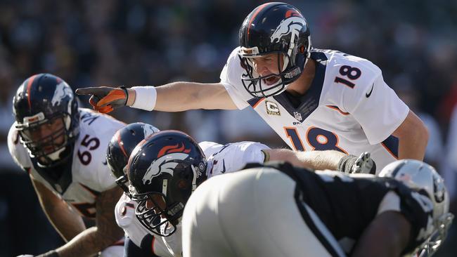 Peyton Manning #18 of the Denver Broncos directs the offense.