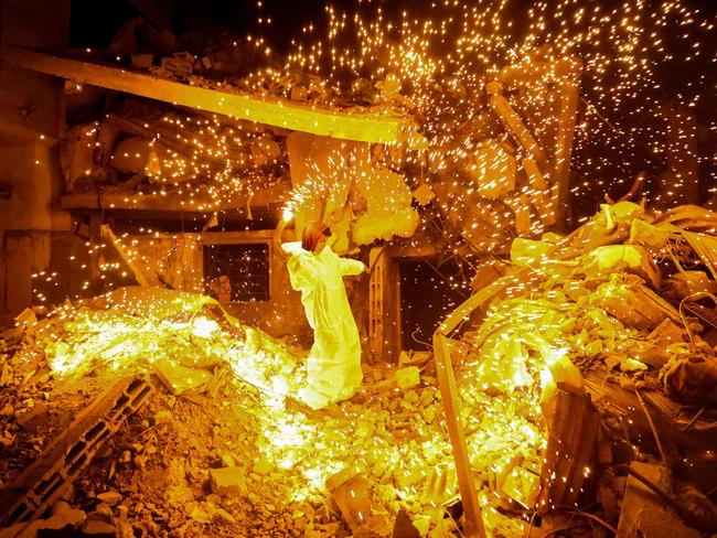 A Palestinian child plays with a sparkler in Rafah, in the southern Gaza Strip, on the eve of the Muslim holy fasting month of Ramadan. Picture: Said Khatib/AFP