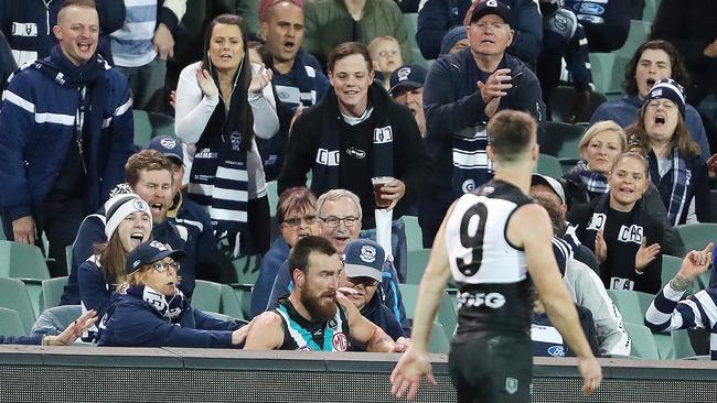 Charlie Dixon took a seat next to Geelong fans at Adelide Oval on Thursday night. Picture: Sarah Reed