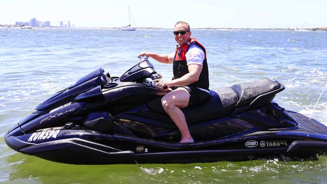 Premier Steven Miles arrives on Jet Ski to Southport on the last day of the Queensland Election campaigning ahead of Saturday’s election day. Picture: Adam Head.