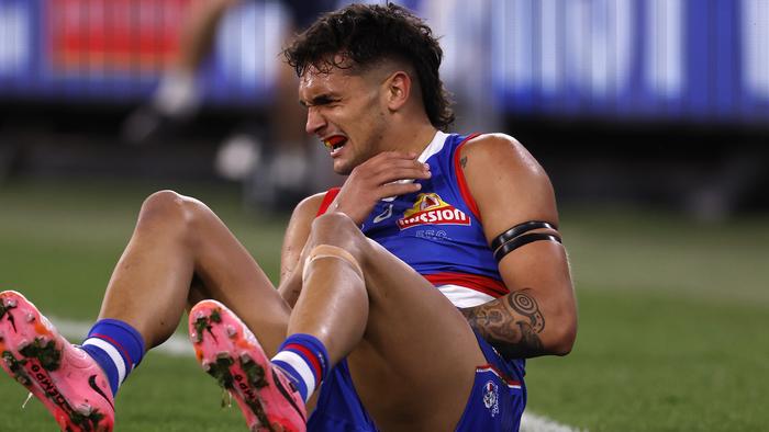 MELBOURNE, AUSTRALIA - SEPTEMBER 06:  Jamarra Ugle-Hagan of the Bulldogs grabs at his shoulder during the AFL Second Elimination Final match between Western Bulldogs and Hawthorn Hawks at Melbourne Cricket Ground, on September 06, 2024, in Melbourne, Australia. (Photo by Darrian Traynor/AFL Photos/via Getty Images)