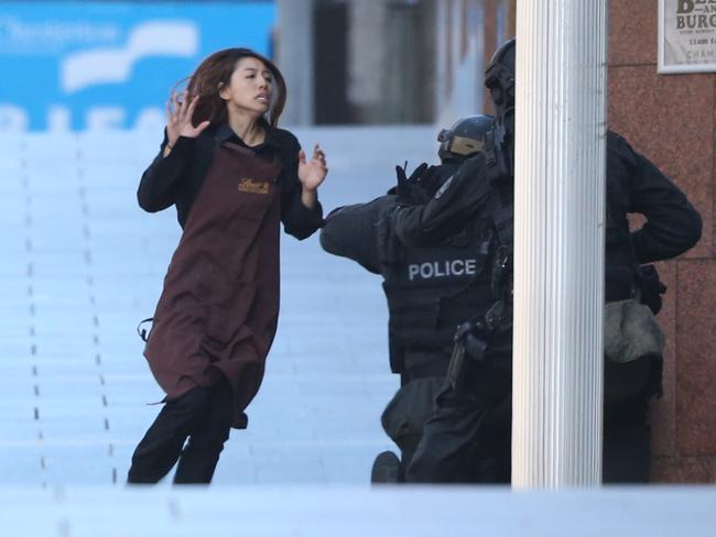 A hostage runs for safety during the Lindt cafe siege / Picture: Adam Taylor