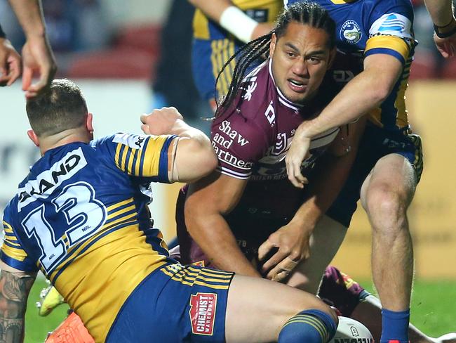 SYDNEY, AUSTRALIA - JULY 18: Martin Taupau of the Sea Eagles scores a try during the round 10 NRL match between the Manly Sea Eagles and the Parramatta Eels at Lottoland on July 18, 2020 in Sydney, Australia. (Photo by Jason McCawley/Getty Images)