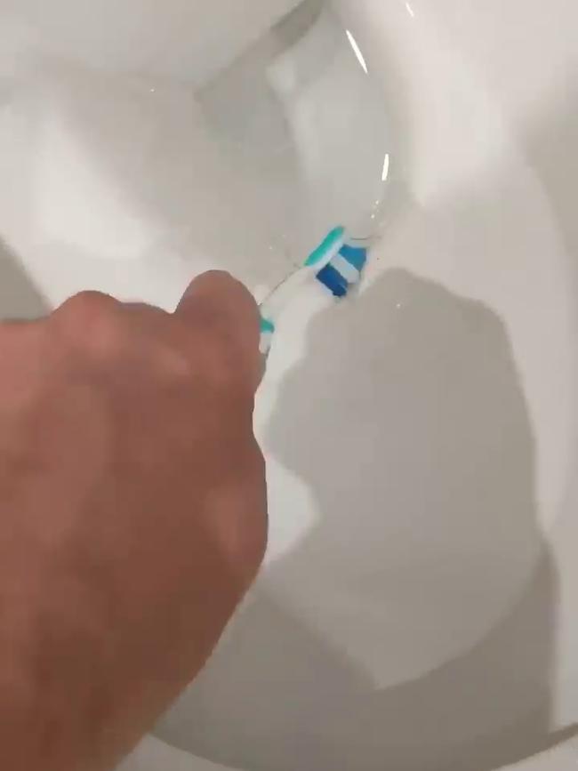 Married At First Sight contestant Dave uses a toothbrush to wash the toilet. Picture: Channel 9