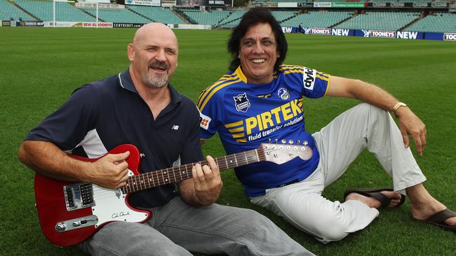 Eric Grothe and Jon English perform the Eels’ anthem in 2011.