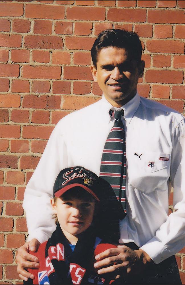 A seven-year-old Dustin Martin with Saints legend Nicky Winmar.