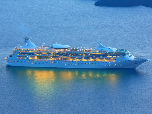 Santorini, Greece - October 17, 2015: Cruise ship " MS Rhapsody of the Seas " from Royal Caribbean International seen from the isalnd of Santorini, Greece in the dawn  Picture: istock