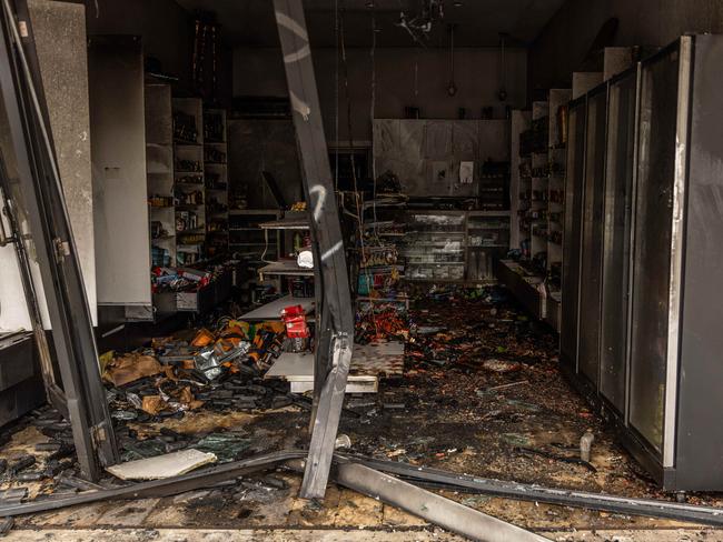 The inside of the shop in ruins after the blaze. Picture: Jake Nowakowski