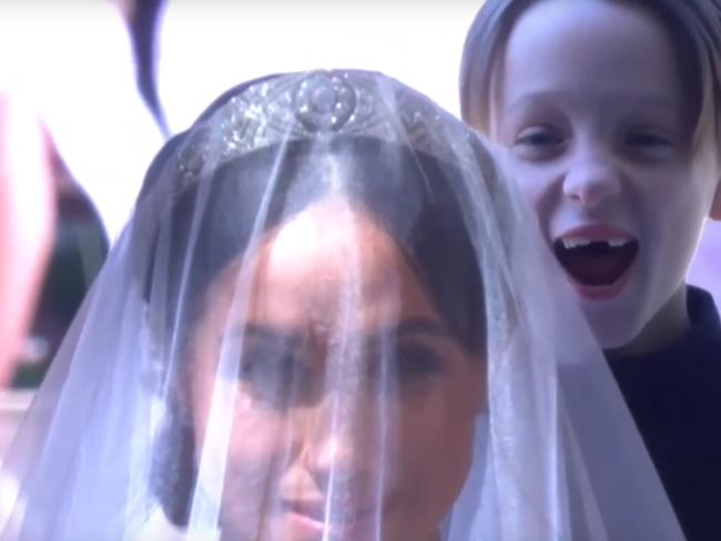 Brian  Mulroney beams as the trumpet fanfare starts up as Meghan Markle enters the chapel.