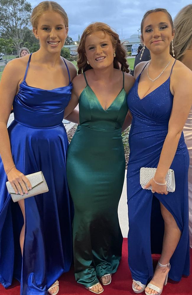 Satin dresses and straight necklines dominated formal fashion for 2023 as Olivia, Renee and Nikita showed at the Mountain Creek State High formal.