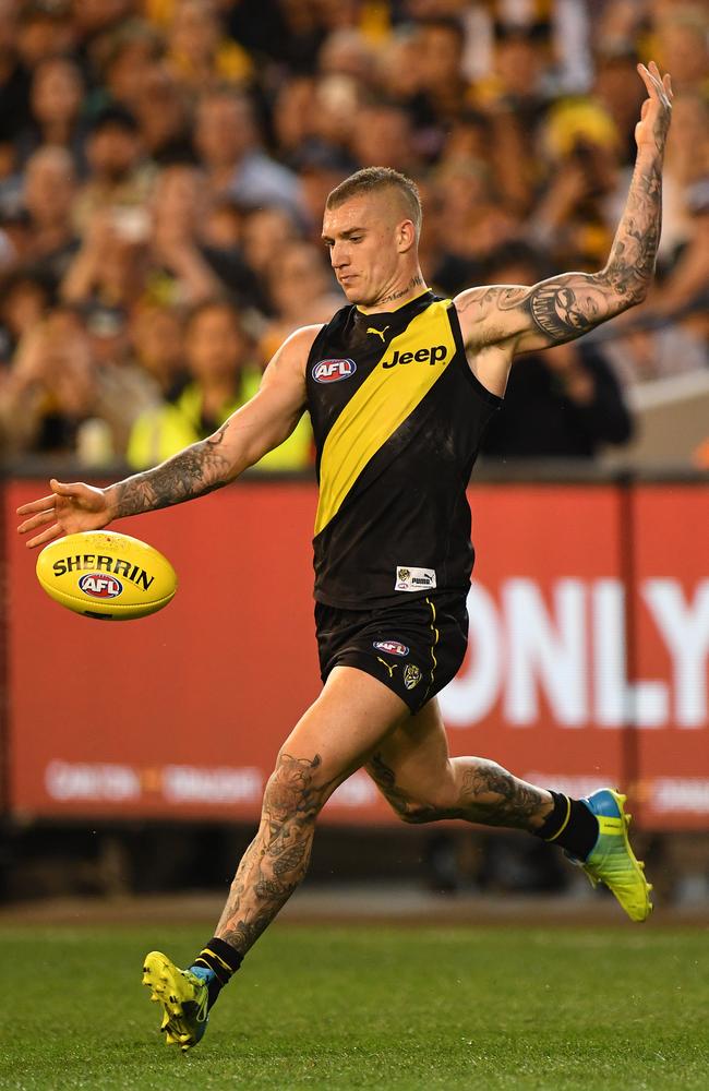 Dustin Martin of the Tigers kicks a goal in the preliminary final against GWS Giants.