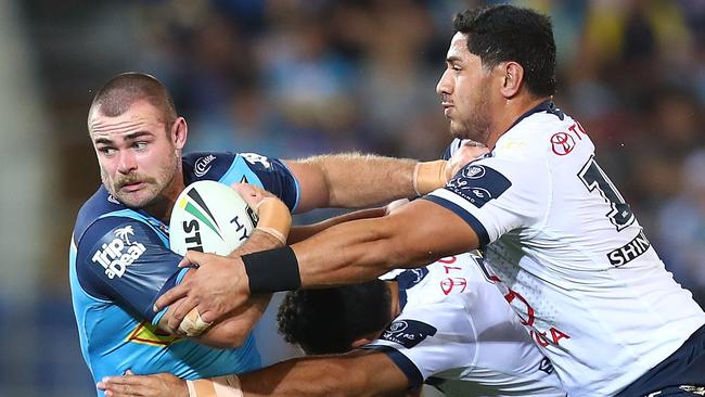 Keegan Hipgrave tries to escape a tackle attempt from the North Queensland Cowboys. Picture: Getty Images