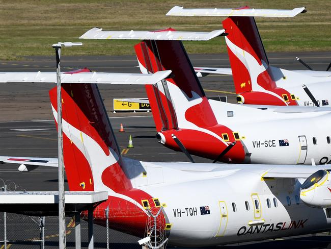 Grounded Qantas planes are seen at Sydney Airport in Sydney, Thursday, June 25, 2020. Qantas will cut at least 6,000 jobs across all parts of the business and continue to stand down 15000 employees as part of its plan to recover from the impact of the COVID pandemic. (AAP Image/Bianca De Marchi) NO ARCHIVING