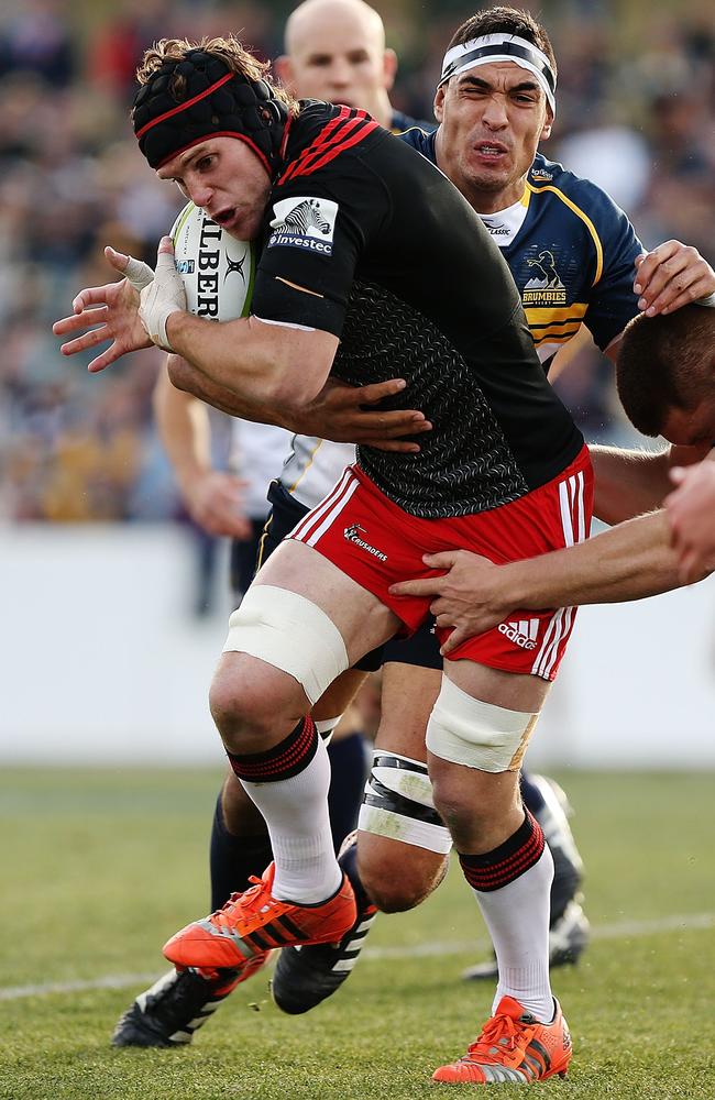 Matt Todd of the Crusaders is tackled by the Brumbies at GIO Stadium.